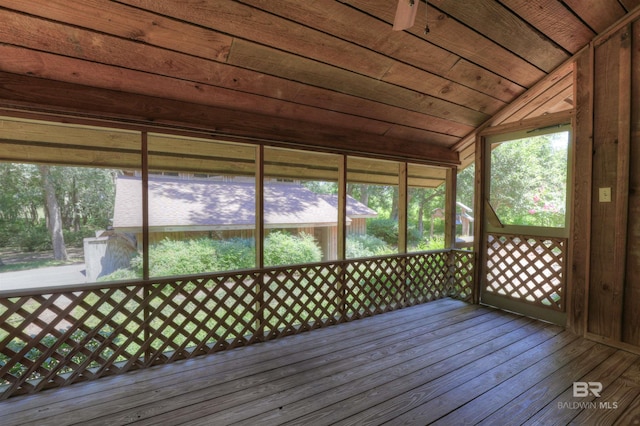 unfurnished sunroom featuring wooden ceiling and vaulted ceiling