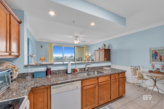 453 Dune Dr Unit 305, Gulf Shores, AL 36542 - kitchen featuring white dishwasher, a sink, ornamental molding, stove, and brown cabinetry