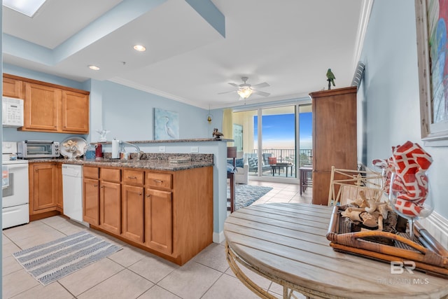 453 Dune Dr Unit 305, Gulf Shores, AL 36542 - kitchen with white appliances, a peninsula, light tile patterned floors, ornamental molding, and a ceiling fan