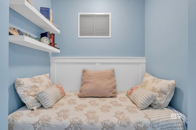 453 Dune Dr Unit 305, Gulf Shores, AL 36542 - bedroom with wainscoting