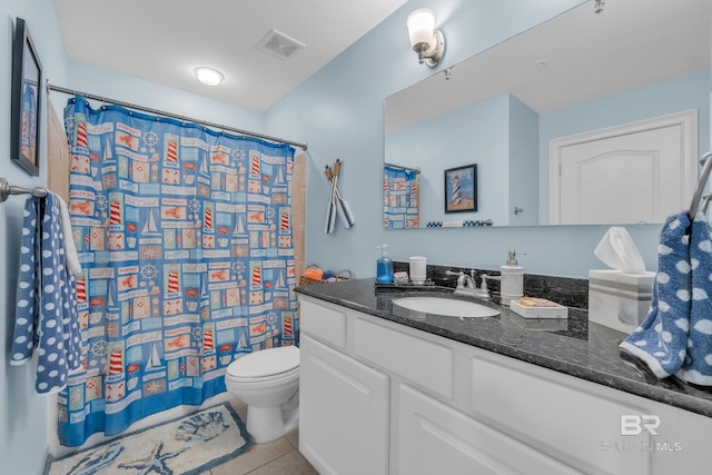 453 Dune Dr Unit 305, Gulf Shores, AL 36542 - bathroom with vanity, toilet, tile patterned floors, and curtained shower