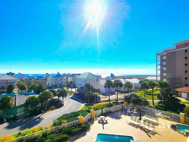 453 Dune Dr Unit 305, Gulf Shores, AL 36542 - community pool with a patio area and a residential view