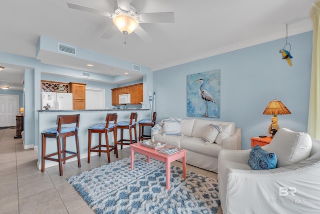 453 Dune Dr Unit 305, Gulf Shores, AL 36542 - living area featuring light tile patterned floors, a ceiling fan, and crown molding