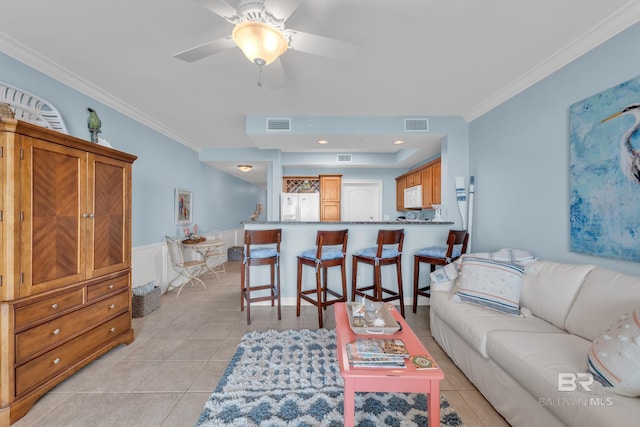 453 Dune Dr Unit 305, Gulf Shores, AL 36542 - living area featuring crown molding, light tile patterned floors, and a ceiling fan