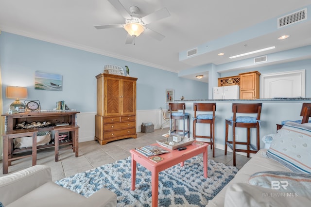 453 Dune Dr Unit 305, Gulf Shores, AL 36542 - living area with crown molding, light tile patterned floors, wainscoting, a ceiling fan, and recessed lighting