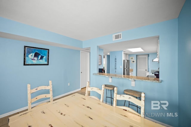 327 E Beach Blvd Unit 7C, Gulf Shores, AL 36542 - dining room featuring baseboards