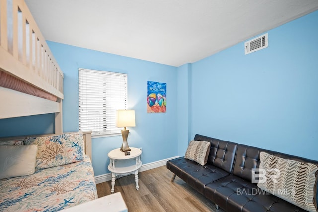327 E Beach Blvd Unit 7C, Gulf Shores, AL 36542 - living area with wood finished floors and baseboards