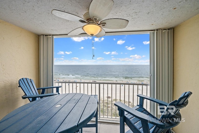 327 E Beach Blvd Unit 7C, Gulf Shores, AL 36542 - balcony with view of water and beach and ceiling fan