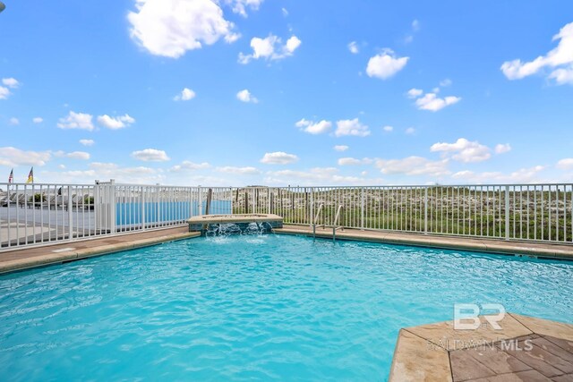 327 E Beach Blvd Unit 7C, Gulf Shores, AL 36542 - community pool featuring a hot tub