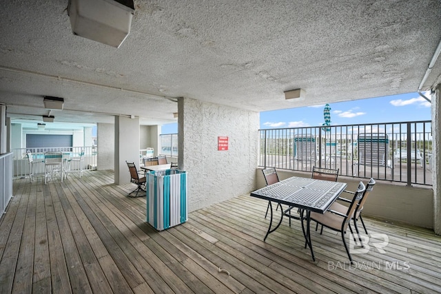 327 E Beach Blvd Unit 7C, Gulf Shores, AL 36542 - deck with outdoor dining space