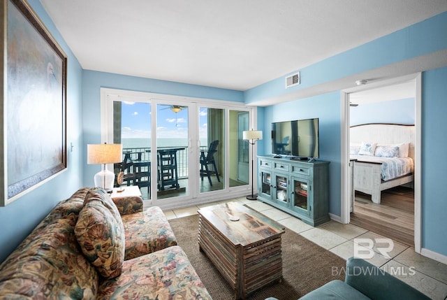 327 E Beach Blvd Unit 7C, Gulf Shores, AL 36542 - living area with tile patterned flooring and baseboards