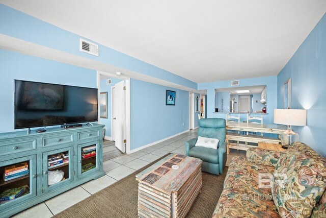 327 E Beach Blvd Unit 7C, Gulf Shores, AL 36542 - living area with tile patterned flooring and baseboards