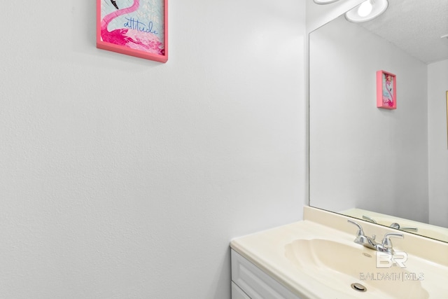 bathroom featuring vanity and a textured ceiling