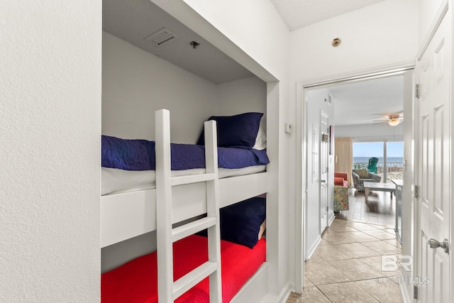 bedroom featuring light tile patterned flooring