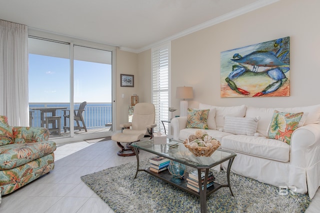 living room with light tile patterned floors, ornamental molding, floor to ceiling windows, and a water view