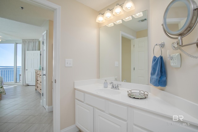 bathroom with vanity and tile patterned floors