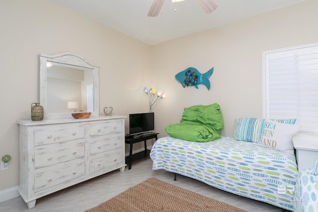 tiled bedroom with ceiling fan