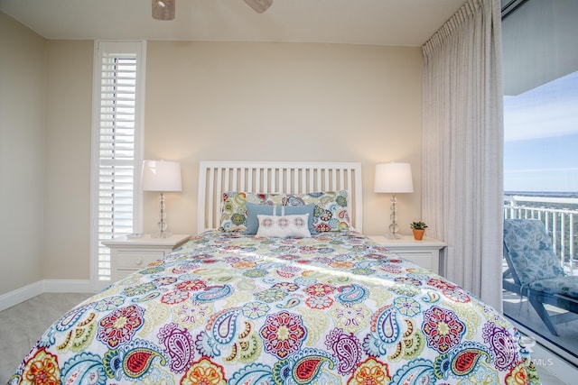 carpeted bedroom featuring ceiling fan and access to exterior