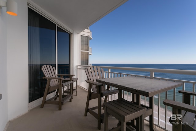 balcony featuring a water view