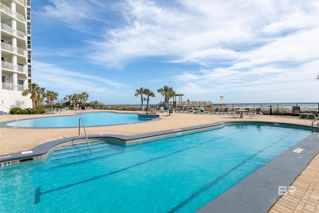 view of swimming pool with a patio