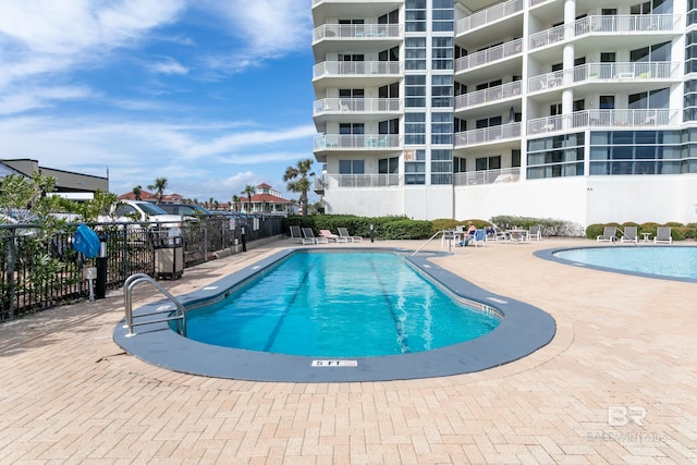 view of swimming pool with a patio