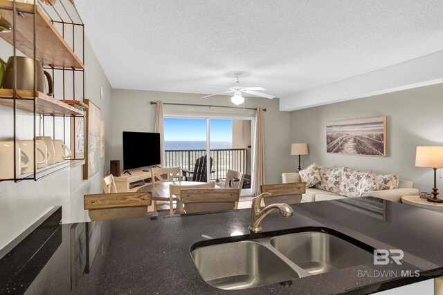 24568 Perdido Beach Blvd Unit 603, Orange Beach, AL 36561 - living room with a textured ceiling and ceiling fan
