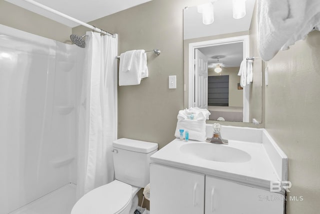 24568 Perdido Beach Blvd Unit 603, Orange Beach, AL 36561 - full bath featuring toilet, vanity, a shower with shower curtain, and a ceiling fan