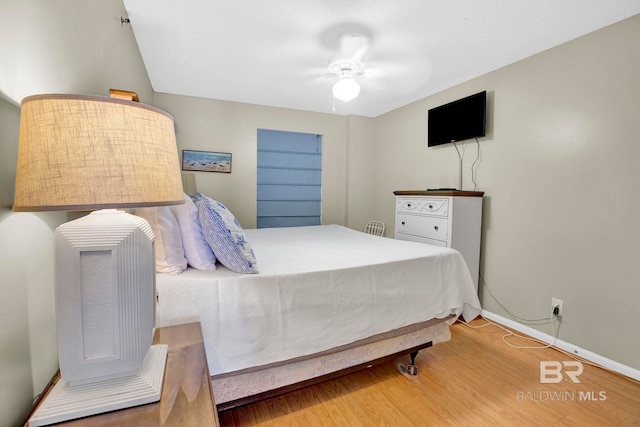 24568 Perdido Beach Blvd Unit 603, Orange Beach, AL 36561 - bedroom featuring wood finished floors, baseboards, and ceiling fan