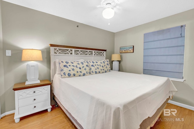 24568 Perdido Beach Blvd Unit 603, Orange Beach, AL 36561 - bedroom featuring wood finished floors, baseboards, and a ceiling fan