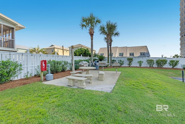 24568 Perdido Beach Blvd Unit 603, Orange Beach, AL 36561 - view of yard featuring a patio, a sunroom, and a residential view