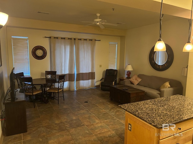 living room featuring ceiling fan