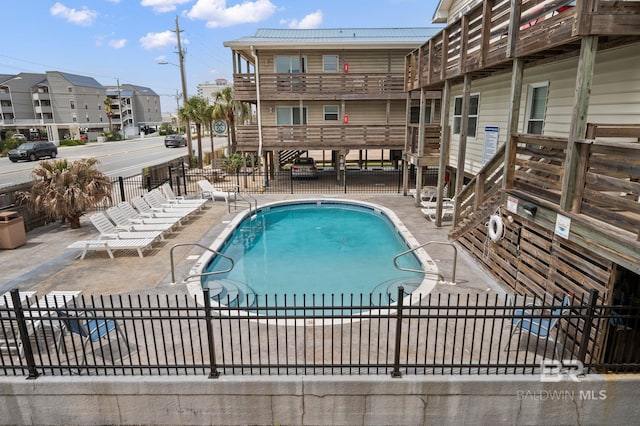344 E Beach Blvd Unit 21, Gulf Shores, AL 36542 - pool with a patio and fence