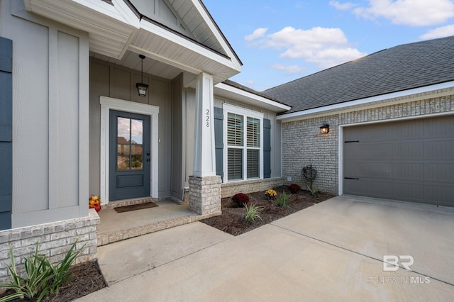 doorway to property with a garage