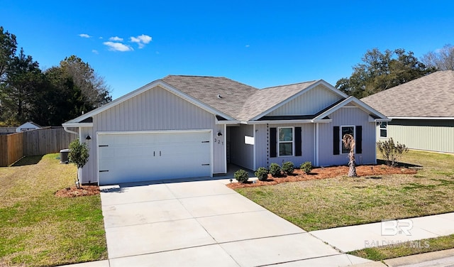 single story home with roof with shingles, an attached garage, a front yard, fence, and driveway