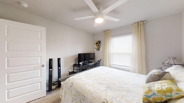 carpeted bedroom featuring a ceiling fan