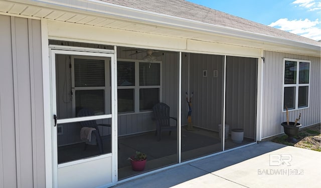 property entrance with roof with shingles