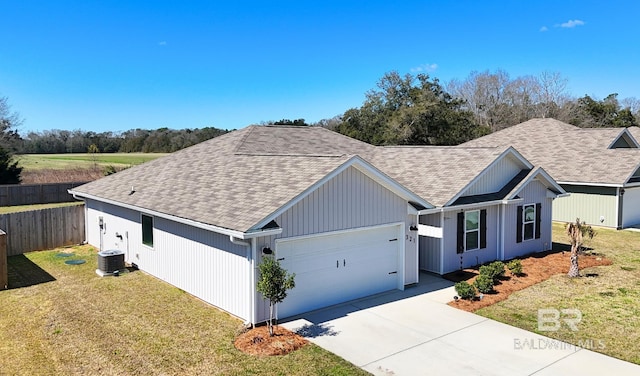 single story home featuring central AC unit, fence, a garage, driveway, and a front lawn