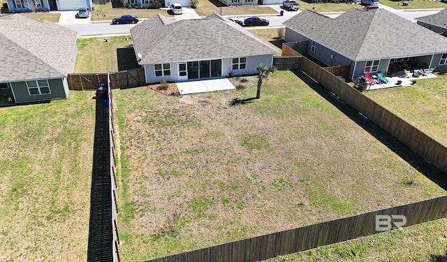 birds eye view of property with a residential view