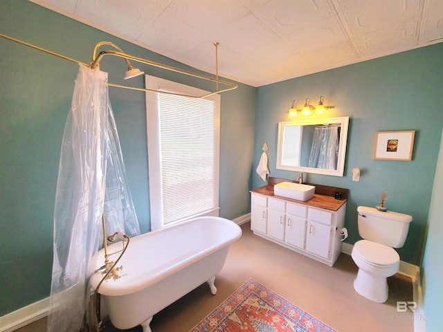 112 Espejo St, Mobile, AL 36604 - bathroom with curtained shower, baseboards, toilet, a freestanding tub, and vanity