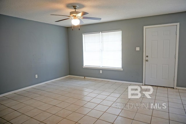 4366 Fathbrook Ln, Mobile, AL 36693 - unfurnished room featuring ceiling fan, light tile patterned floors, a textured ceiling, and baseboards