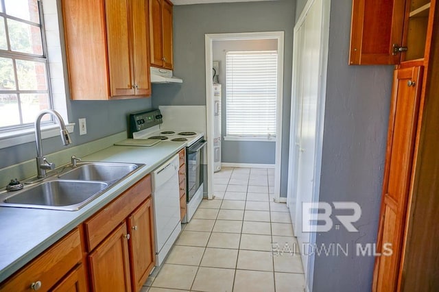 4366 Fathbrook Ln, Mobile, AL 36693 - kitchen with under cabinet range hood, a sink, white appliances, light tile patterned floors, and plenty of natural light
