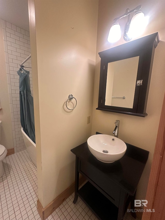 full bathroom featuring shower / bath combo, tile patterned floors, vanity, and toilet