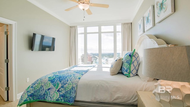 bedroom with crown molding and ceiling fan