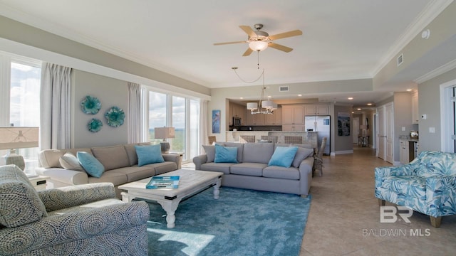 living room featuring crown molding, ceiling fan with notable chandelier, and light tile patterned floors