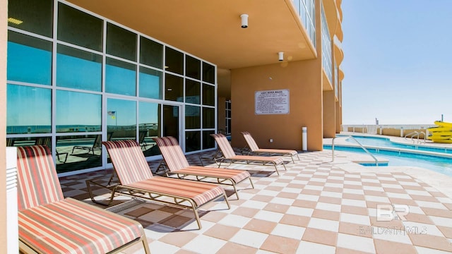 view of patio featuring a community pool