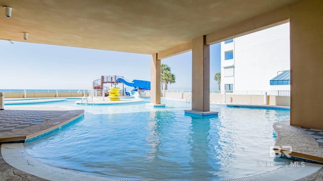 view of pool with a water slide