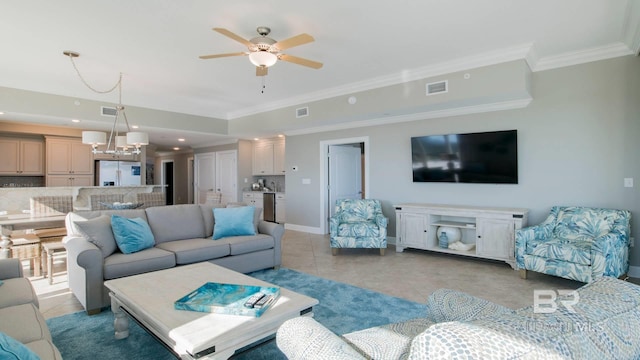 living room featuring crown molding, ceiling fan with notable chandelier, and light tile patterned floors