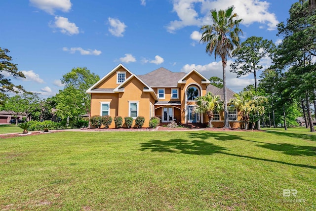 craftsman inspired home featuring a front lawn