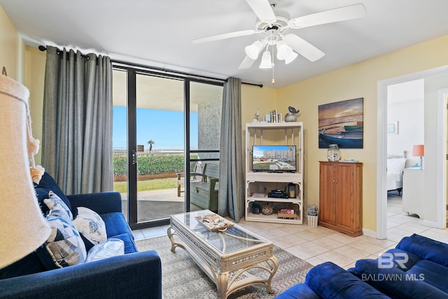 tiled living room featuring ceiling fan