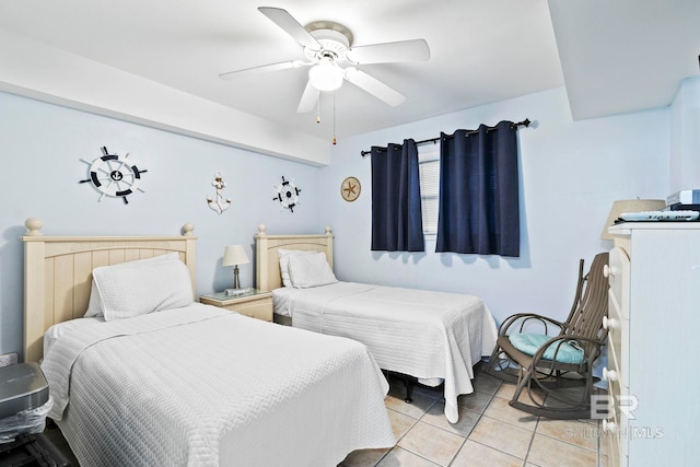 bedroom featuring light tile patterned flooring and ceiling fan